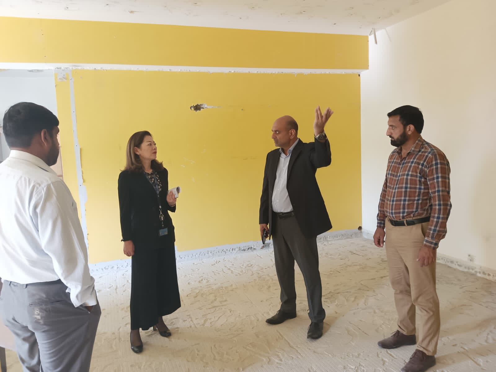 Ali Brothers and IOM representatives reviewing refurbishment progress at IOM Building II